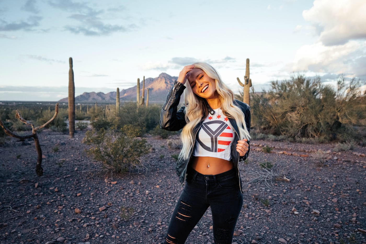 A woman standing in a desert