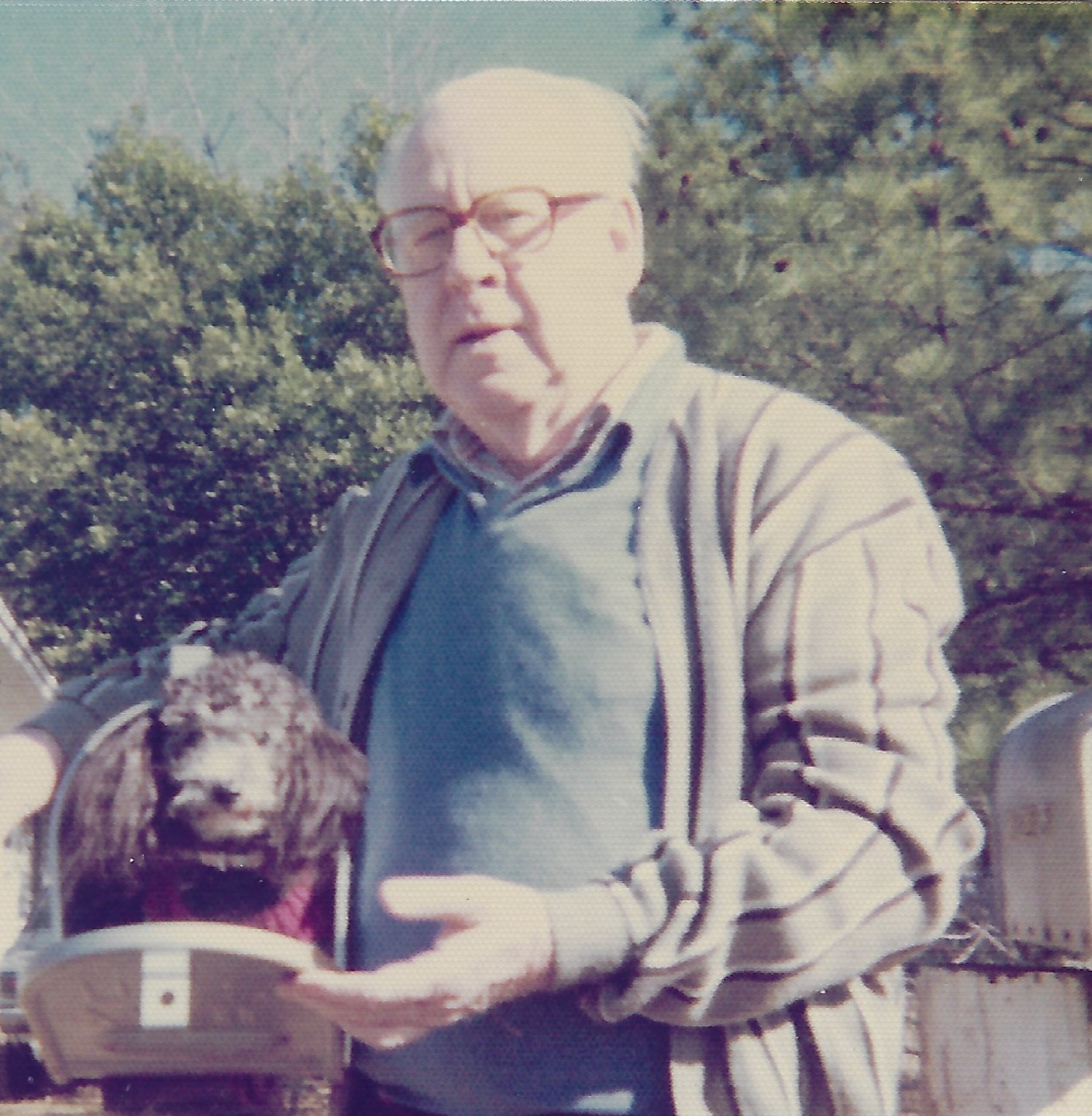 Gramps stands to the right of the open mailbox which contains a tiny dog, wearing a little sweater, Nerd. (1977)