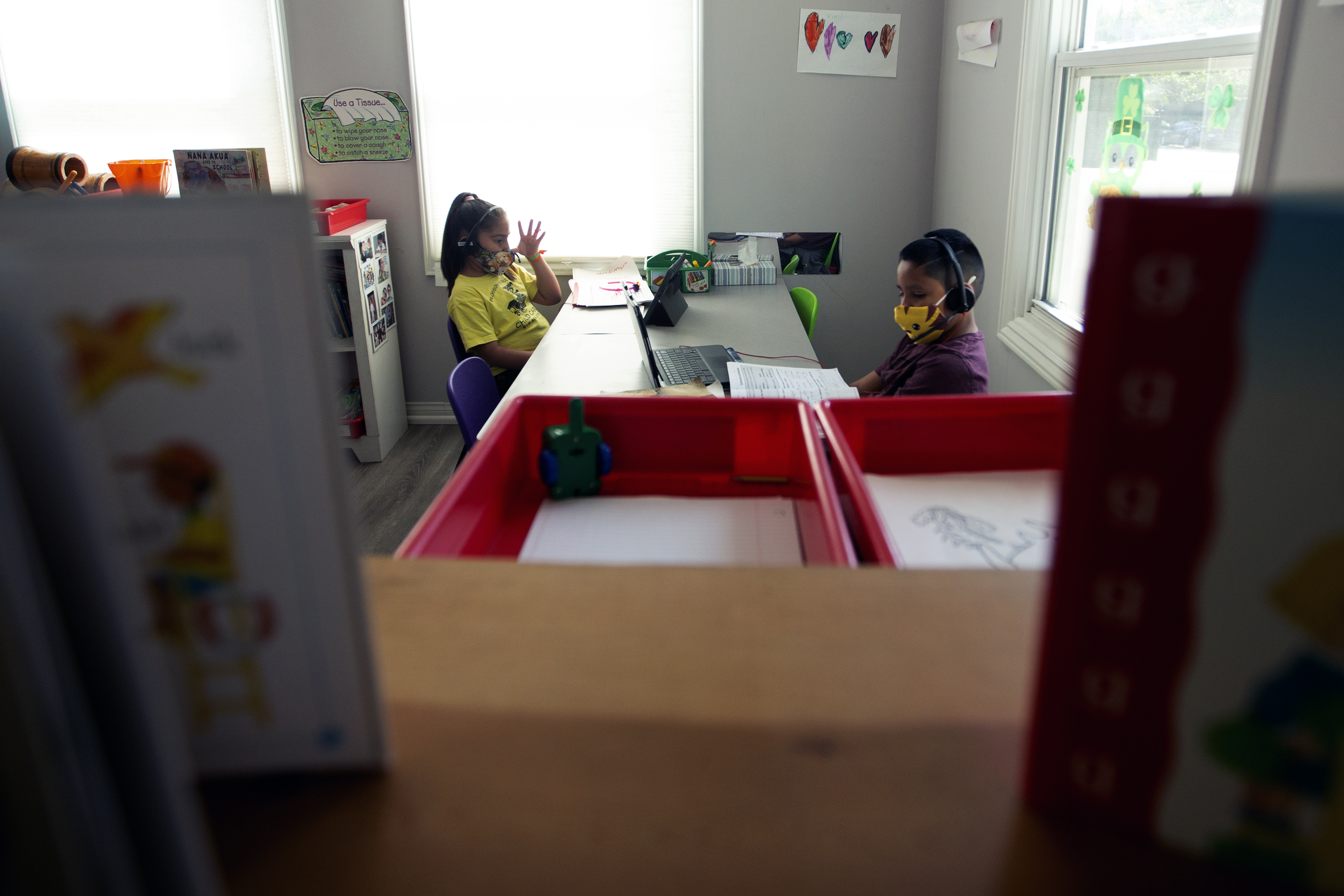 Children at Silvia's daycare do school work in Van Nuys on April 9 2021 photo by Shae Hammond for CalMatters