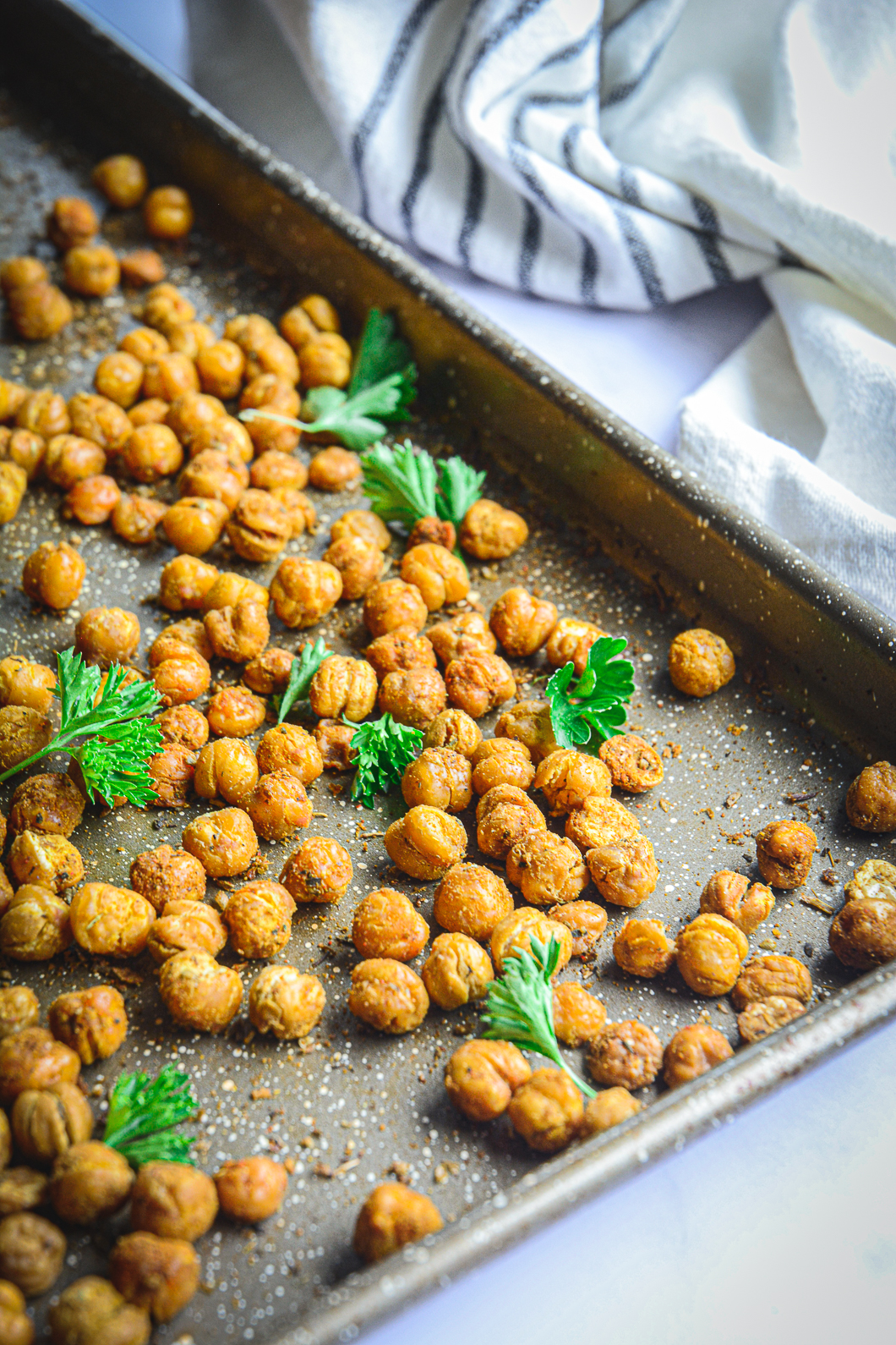 Roasted chickpeas on tray with parsley