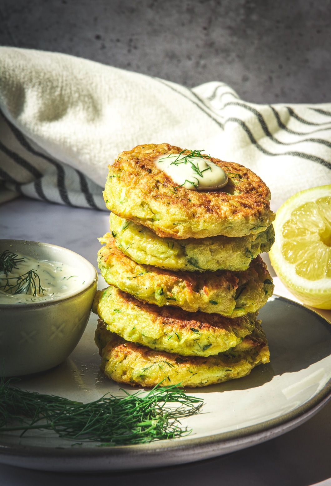 Zucchini Rutabaga Fritters stacked on plate