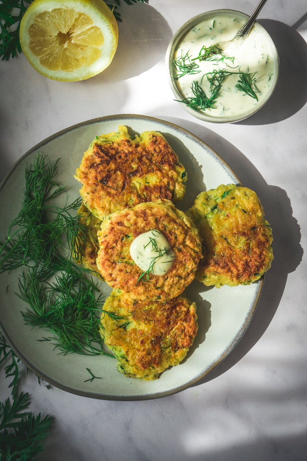 Zucchini Rutabaga Noodles on plate with dill mayo sauce