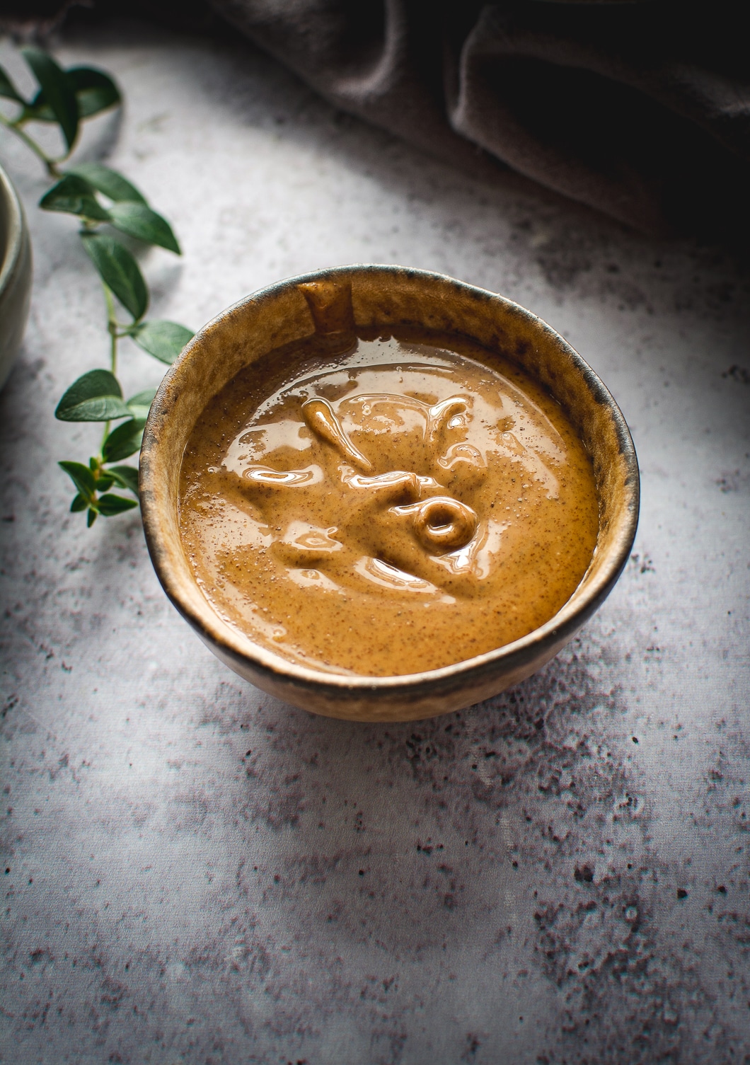 Almond butter in little bowl on table