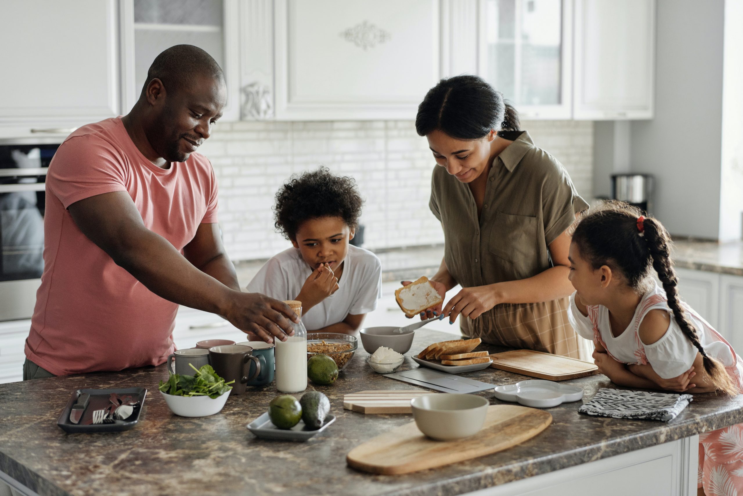 Family preparing a meal in kitchen: holiday rentals
