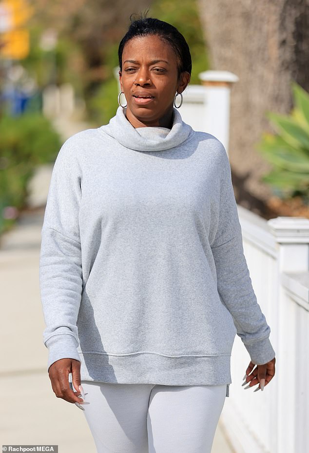 Free flowing: The mother of five from Violet, Louisiana initially wore a festive red turban, but doffed the headgear to show off her newly freed tresses