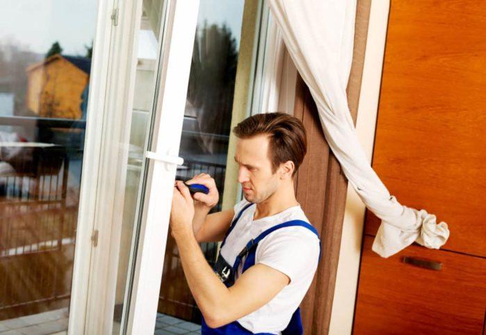 handyman repair window with screwdriver Home Upgrades That Add Value