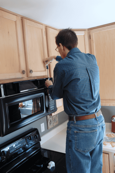 Unscrew the microwave How to Remove Over-The-Range Microwave Made Easy