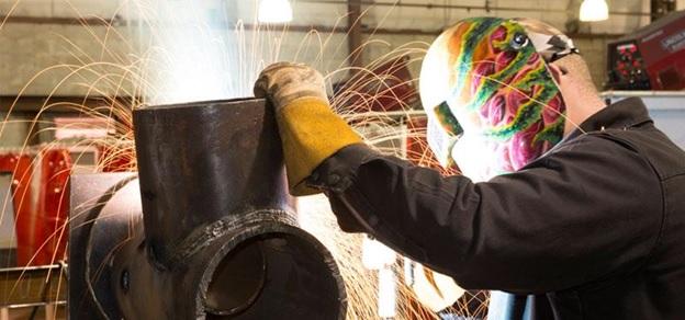 man wielding Pipe fitting Career Option