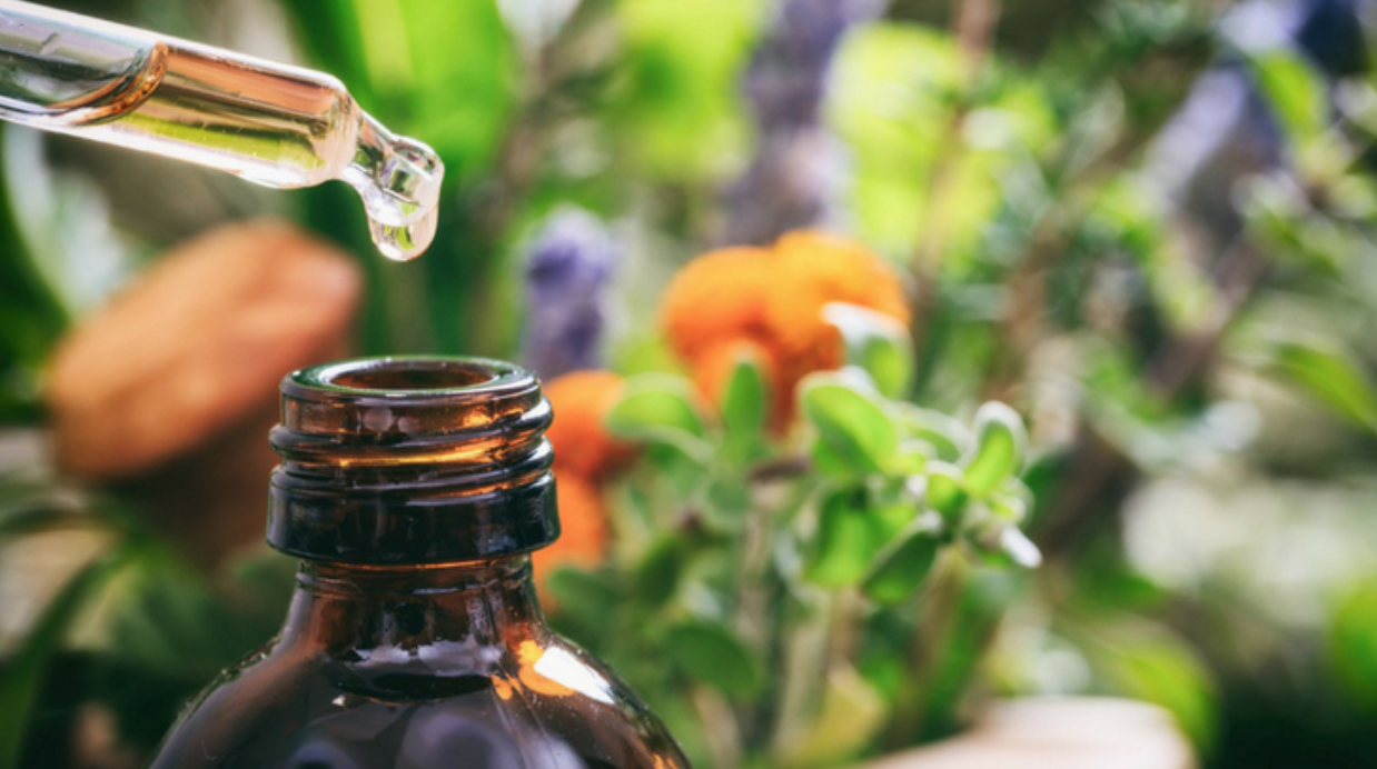 CBD oil dropped into a glass bottle