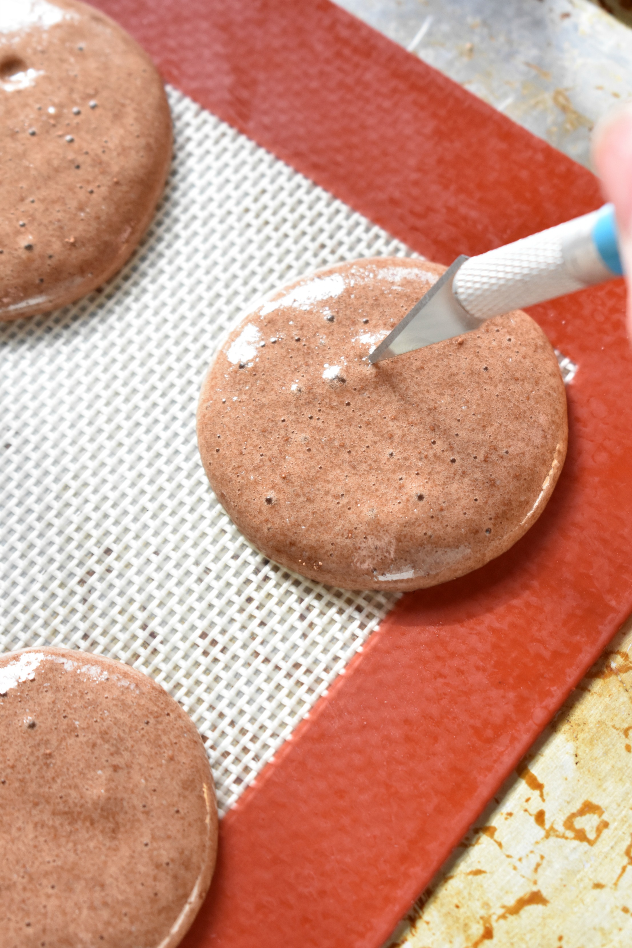 Popping air bubbles in macaron batter