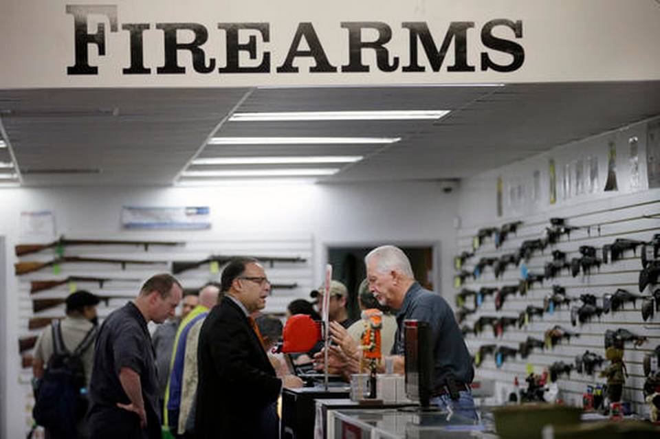 Sales associate Mike Conway, right, ...