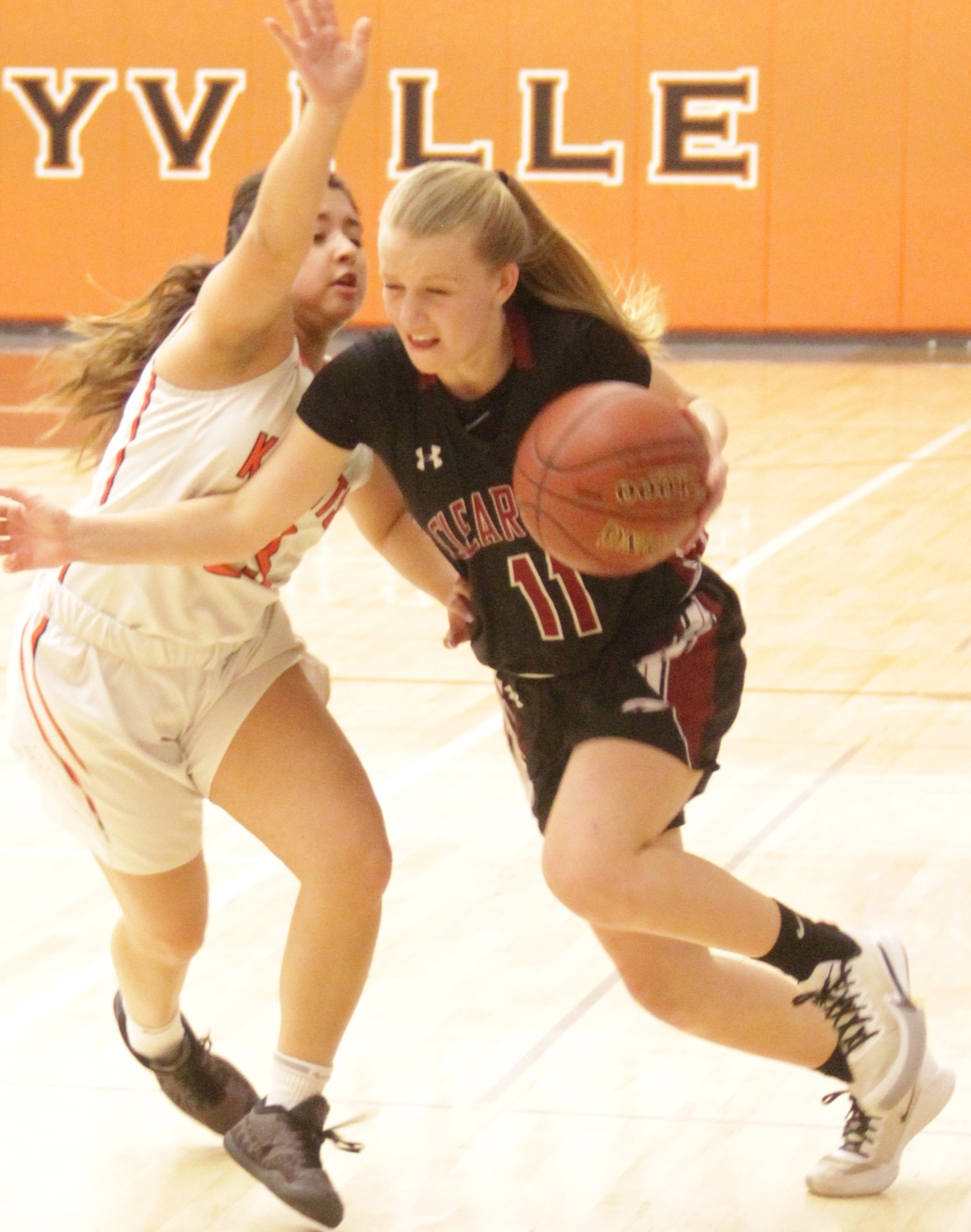 Clear Lake's Sydney Howe (11) dribbles around Kelseyville defender Paloma Ortiz during the Cardinals' 53-32 road win nearly a year ago today in Kelseyville. (File photo)