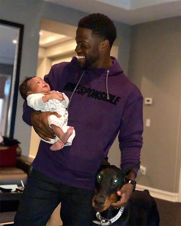 Kevin Hart and Baby Kenzo from Celebrities Celebrate the Holidays 2017