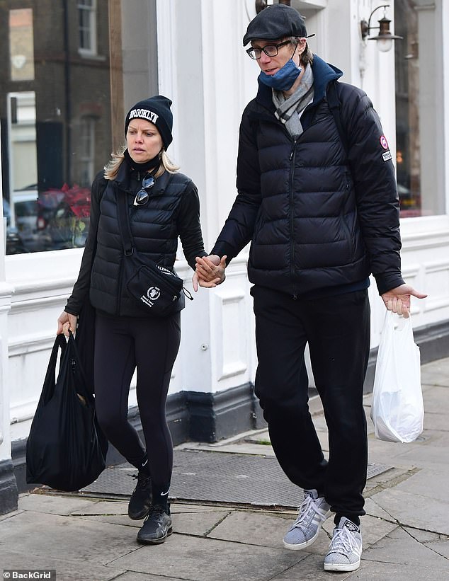 Stephen Merchant and his partner Mircea Monroe wear padded jackets for