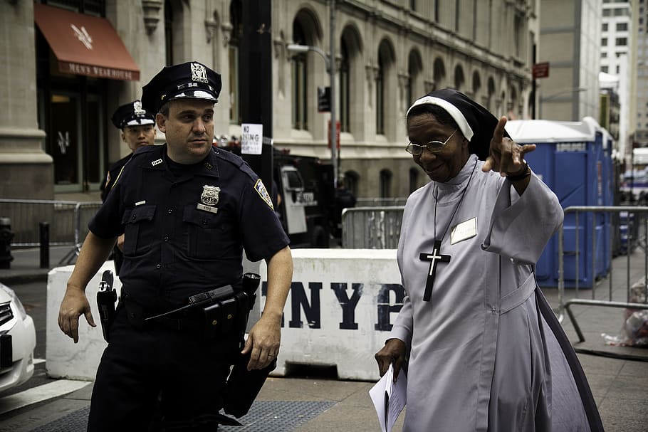 HD wallpaper policeman assist a nun, two people, uniform, architecture