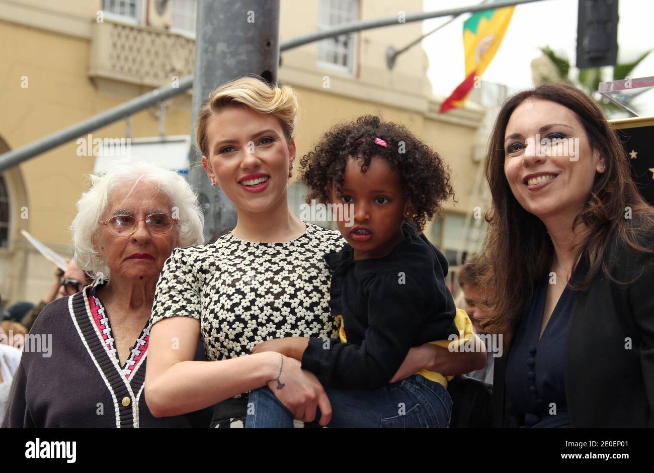 Actress Scarlett Johansson of 'Marvel's The Avengers' (C) poses with her grandmother Dorothy