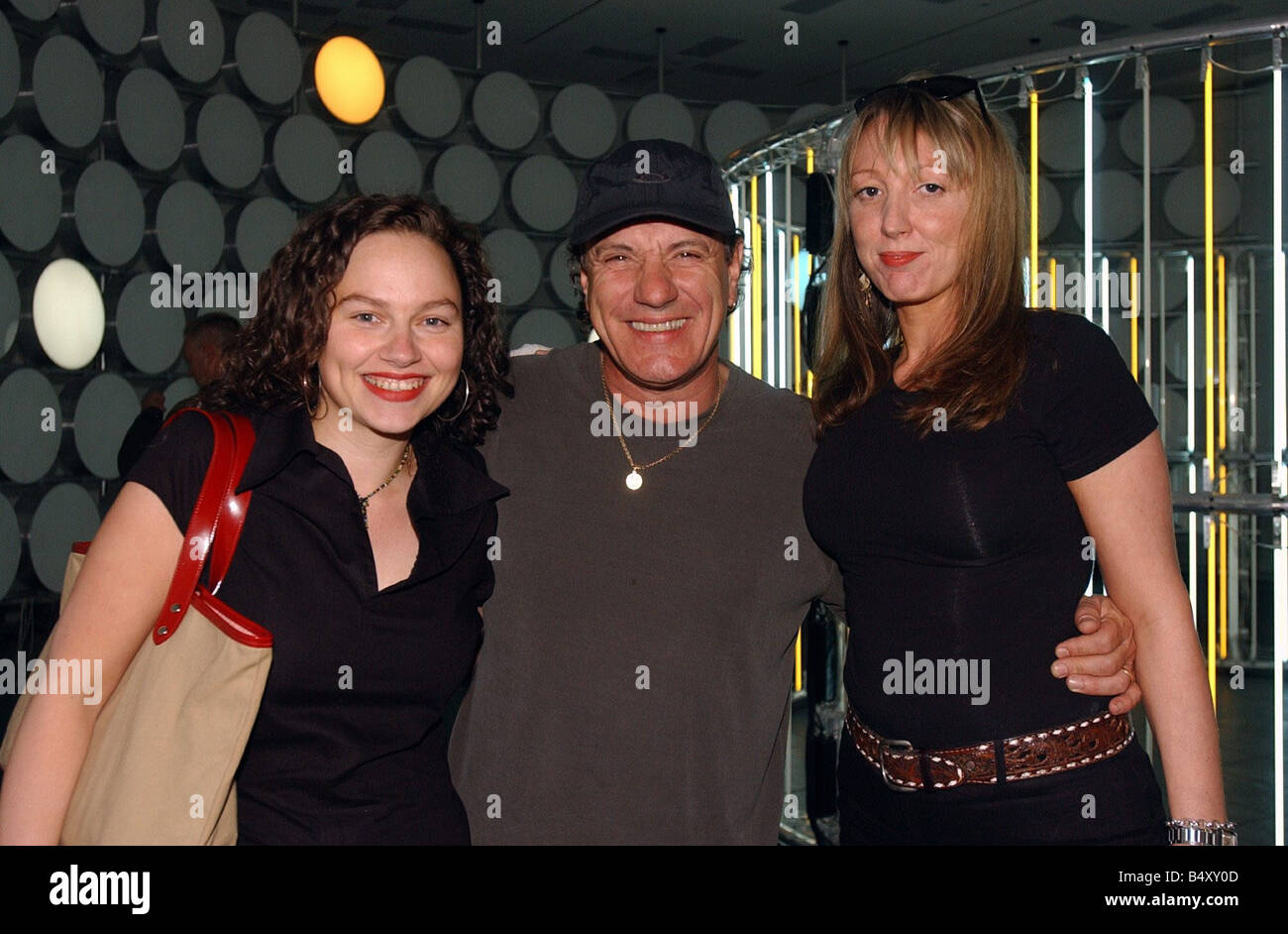 Brian Johnson lead singer of the rock group AC DC with his daughters