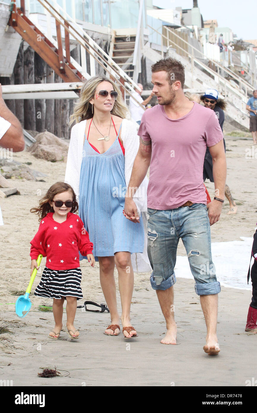 Cam Gigandet and his wife Dominique Geisendorff walk with their Stock