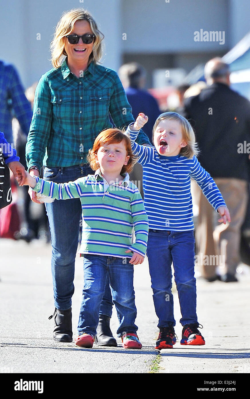 Amy Poehler takes her children Archie and Abel to a local Stock