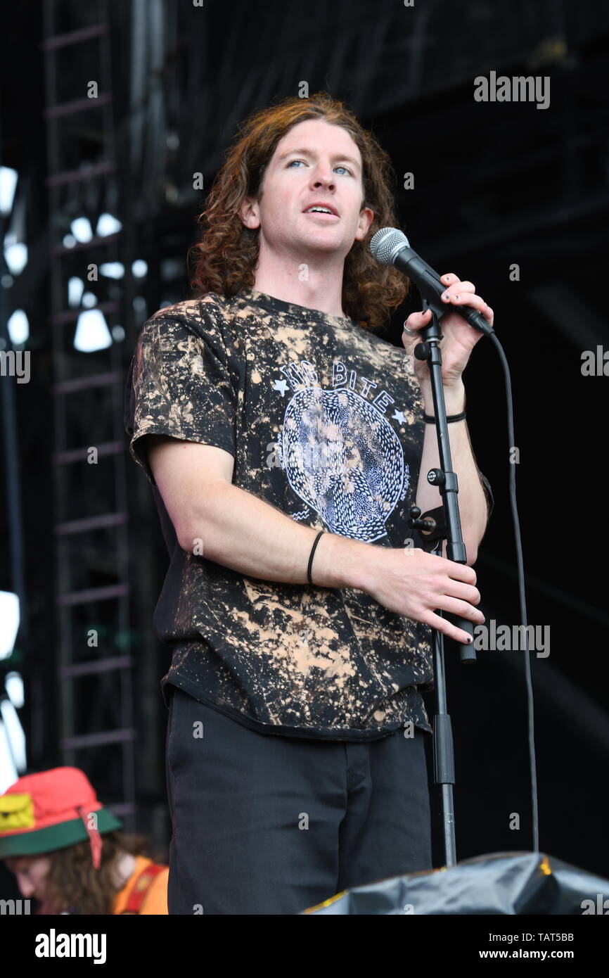 Singer Brendan Yates is shown performing on stage during a "live" stand