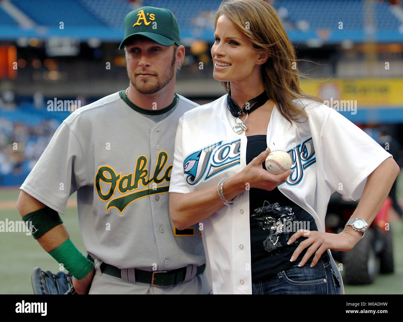 Oakland Athletics' Mark Kotsay and supermodel Monika Schnarre chat with