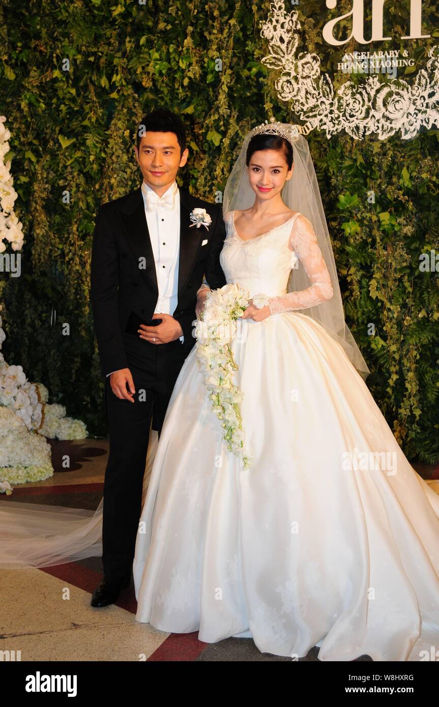 Chinesische Schauspieler Huang Xiaoming, Links und seine Schauspielerin Frau Angelababy Pose