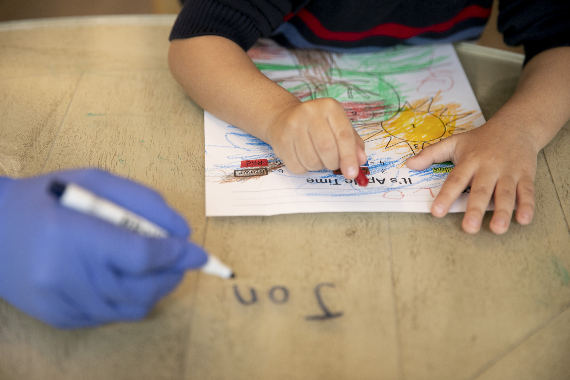 Jonathan, 4, works on a coloring activity during online preschool at his home in Tracy on March 3, 2021. Jonathan, who is on the autism spectrum, is aided by a one-on-one therapist three days a week who helps with online learning and behavioral issues. Photo by Anne Wernikoff, CalMatters