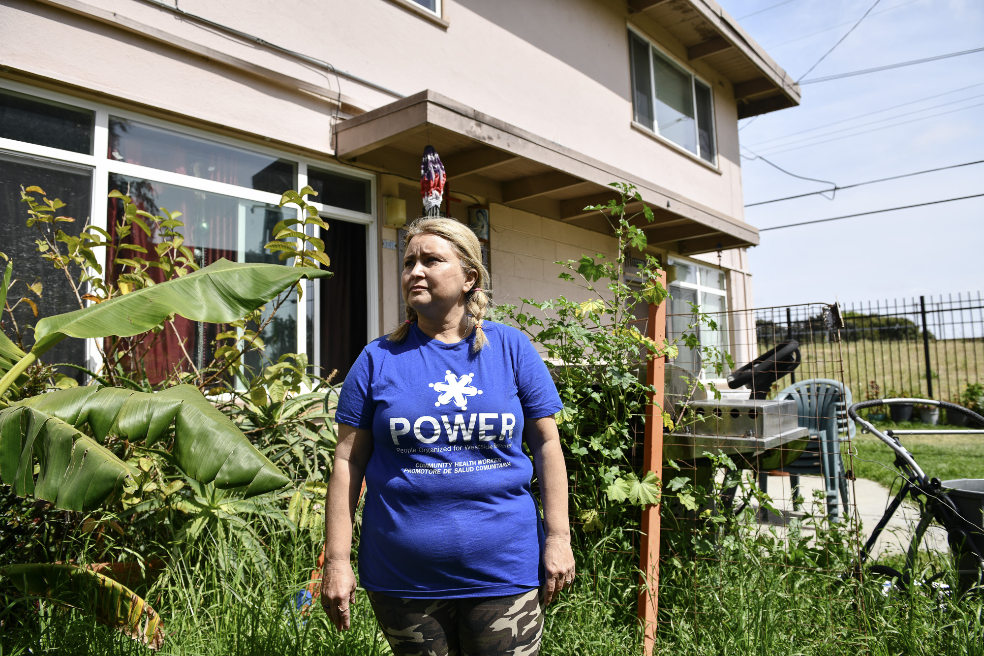 Daisy Vega, president of the resident advisory council at the Mar Vista Gardens public housing complex, poses for a portrait in her front yard on April 14, 2021. Photo by Pablo Unzeuta for CalMatters