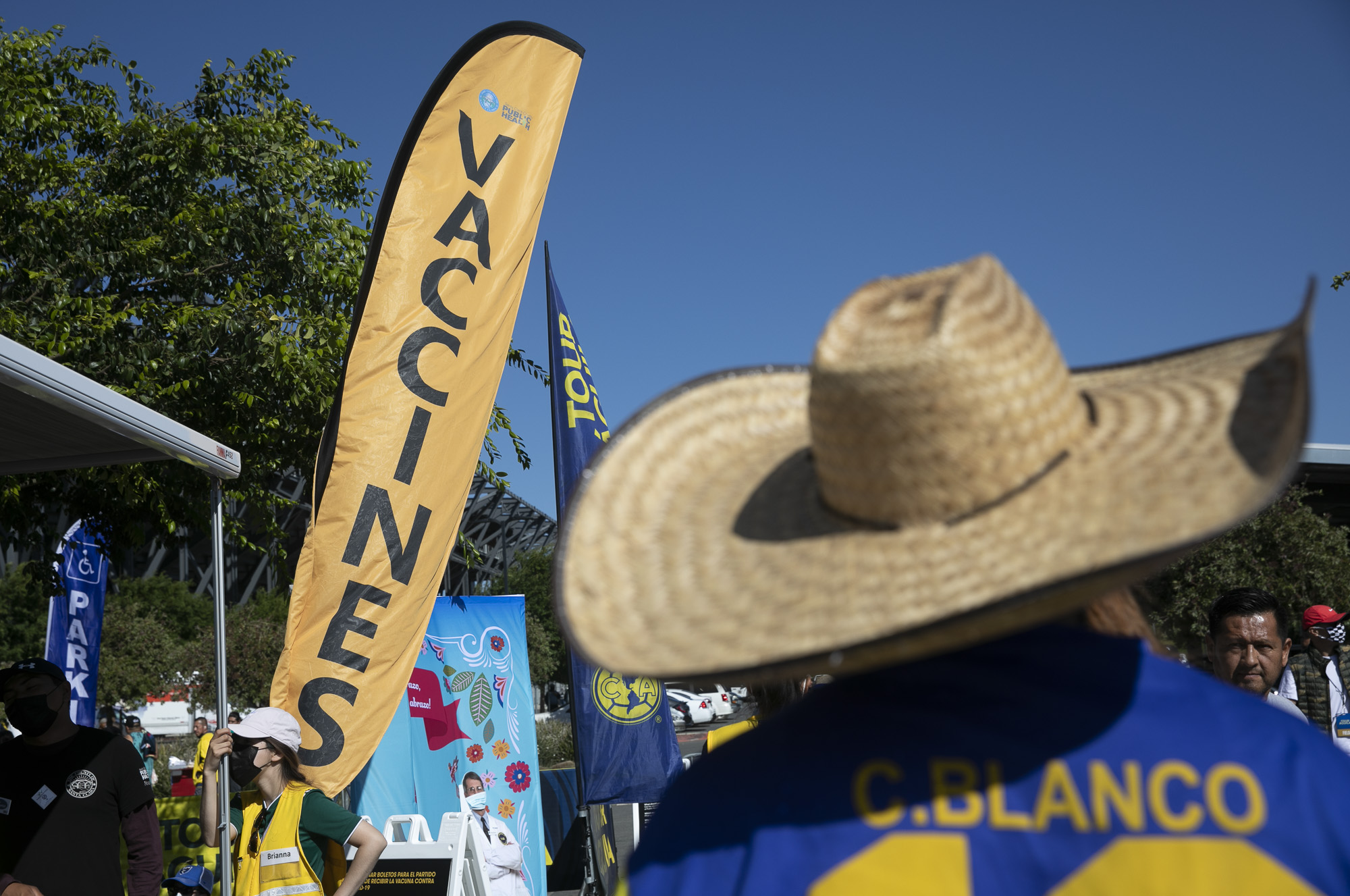 Fans walk past a vaccination pop-up during an event sponsored by the California Department of Public Health to increase vaccine awareness at a Club America vs. Atlas FC soccer Match at PayPal Park on July 7, 2021 in San Jose. Photo by Anne Wernikoff, CalMatters