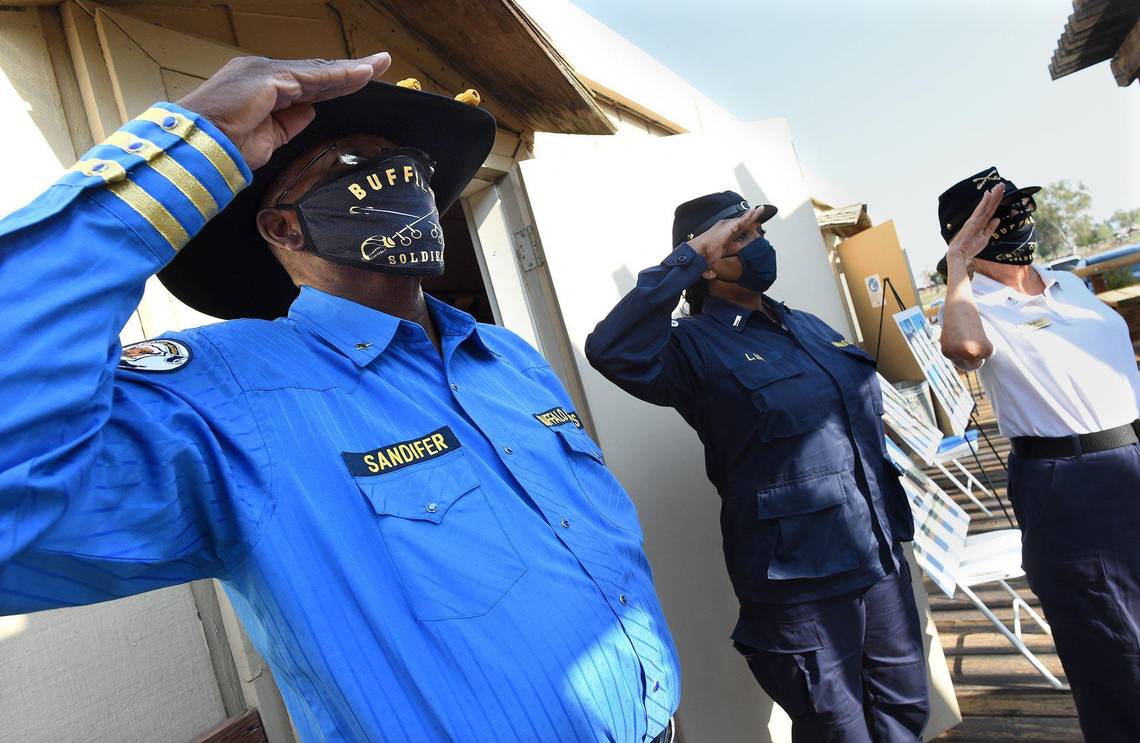 Members of the African American Network of Kern County Buffalo Soldiers, including Isaac Sandifer, left, salute during the playing of the National Anthem at the rededication of Allensworth State Historical Park, Wed. Aug. 26, 2021. Photo by John Walker/The Fresno Bee