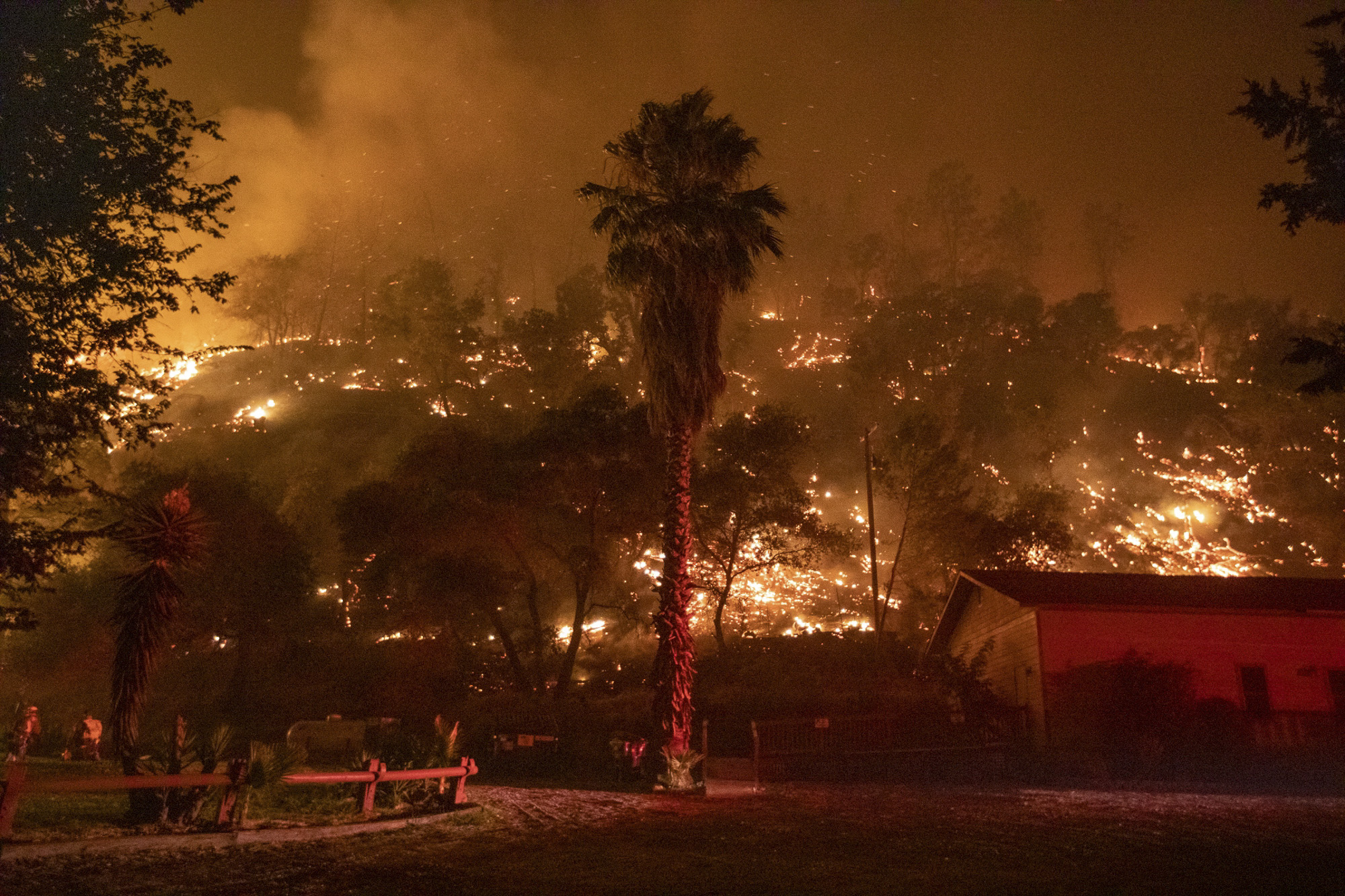 The LNU Lightning Complex wildfire burns a hillside behind the Canyon Creek Resort in Winters on Aug. 20, 2020. Photo by Anda Chu, Bay Area News Group