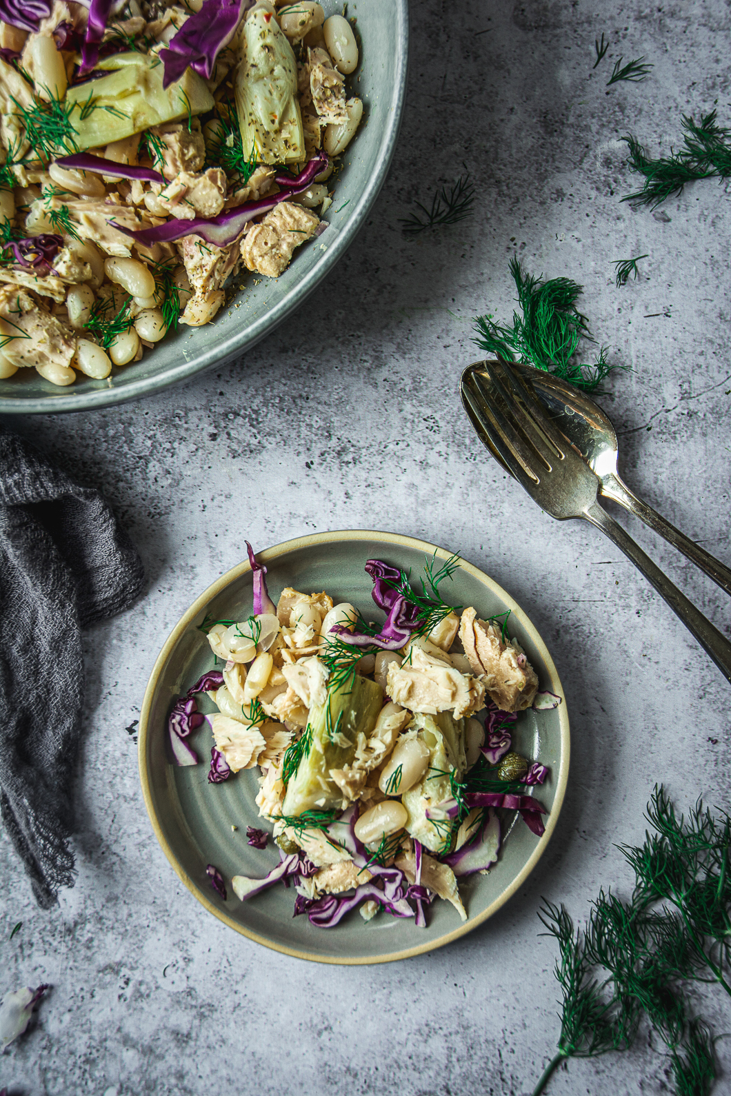 White Bean Tuna Salad with Artichoke Hearts in bowl and on small plate