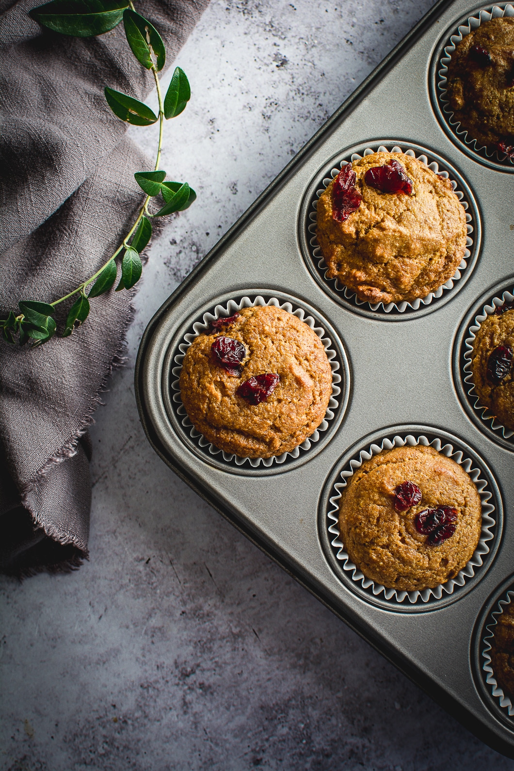 Healthy Grain-Free Cranberry Pumpkin Spice Muffins in muffin tin