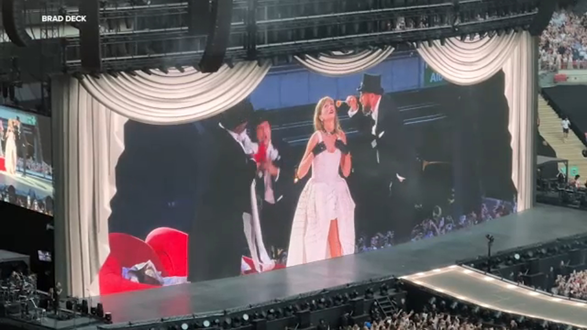 Taylor Swift joined onstage by boyfriend Travis Kelce in tuxedo at