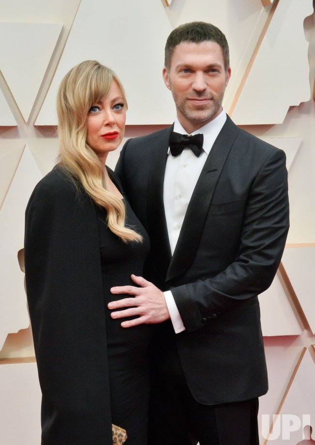 Donna Huyssoon and Travis Knight arrive for the 92nd annual Academy