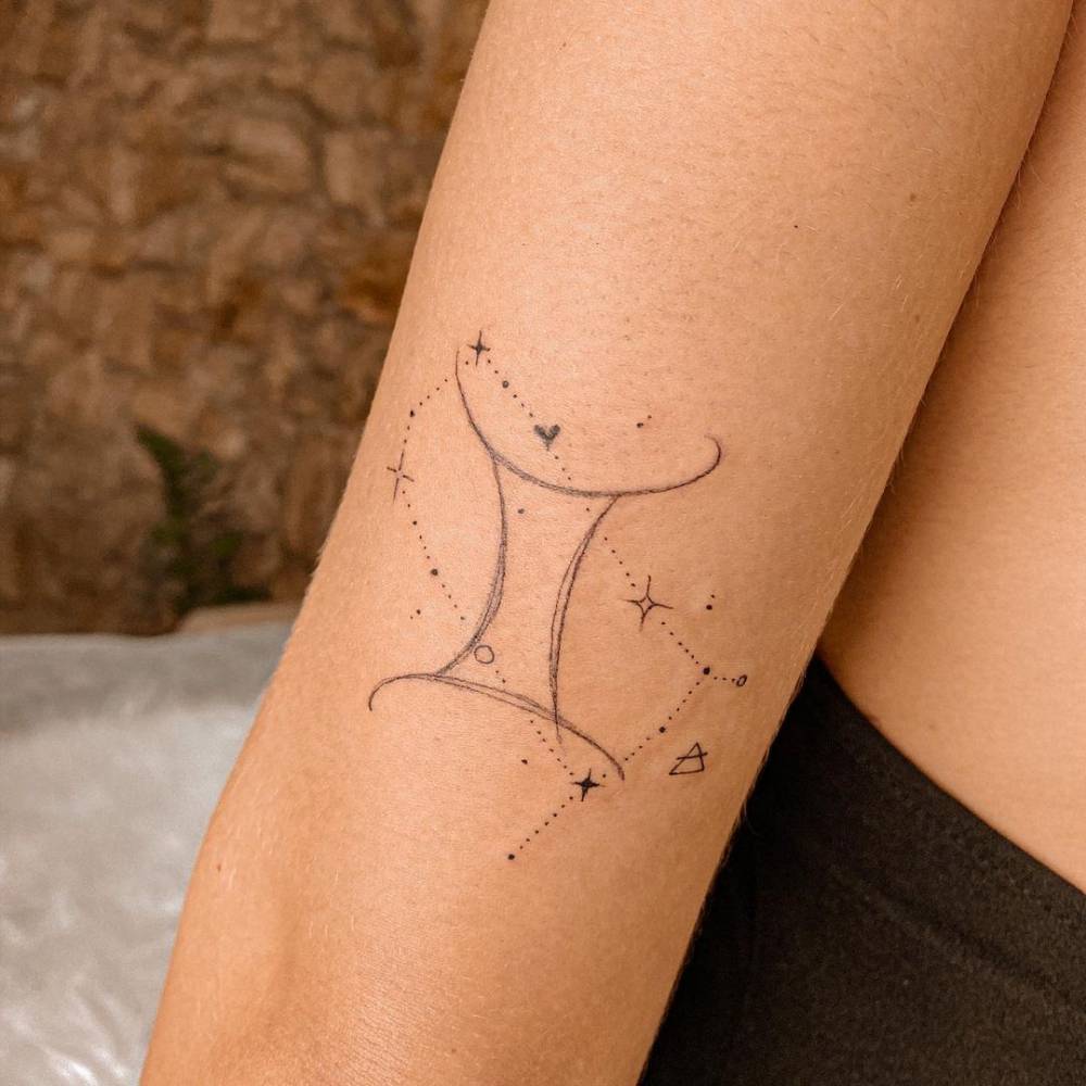 Fine line Gemini symbol and constellation tattoo on the