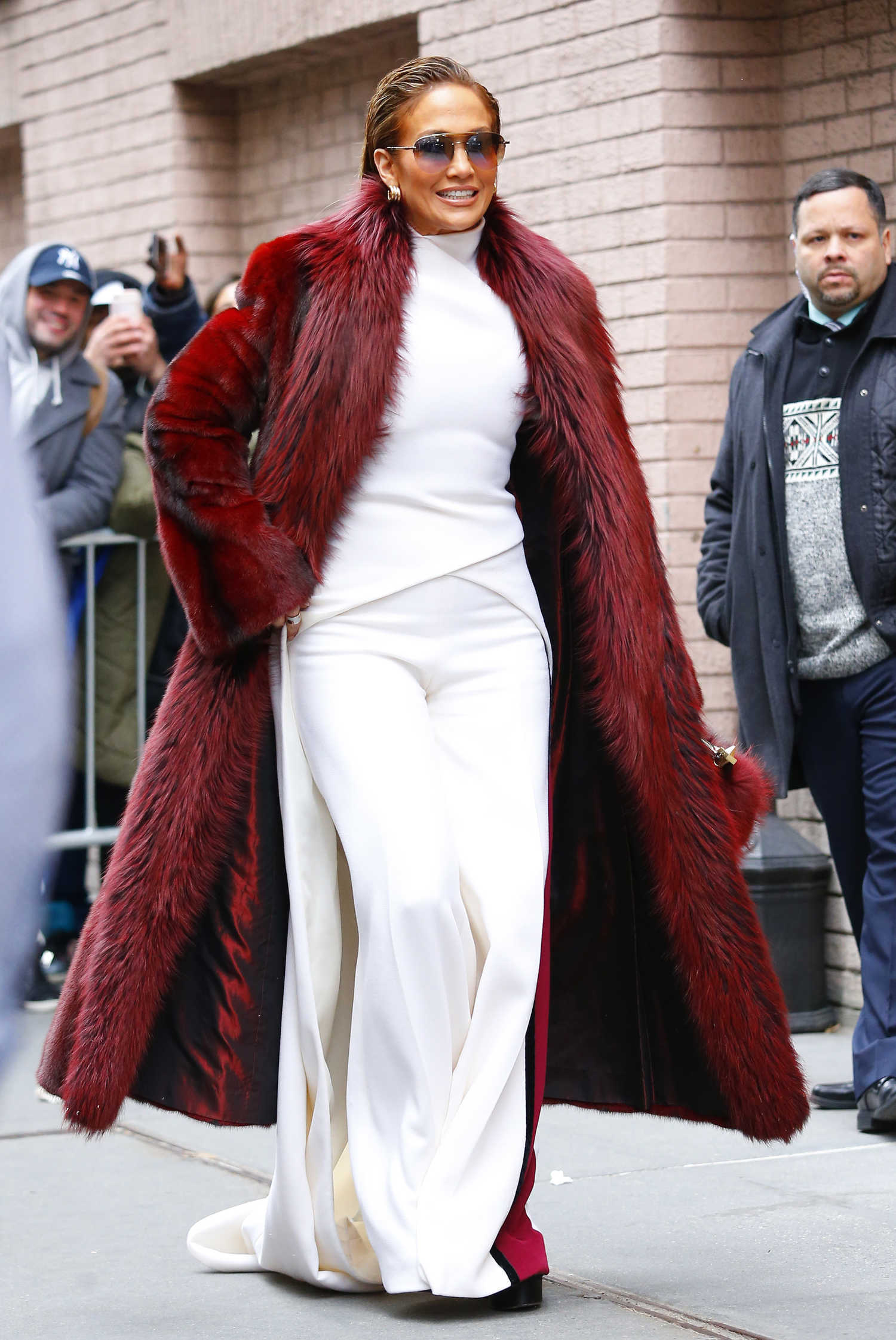Jennifer Lopez in a Long Red Fur Coat Arrives at The View TV Show in