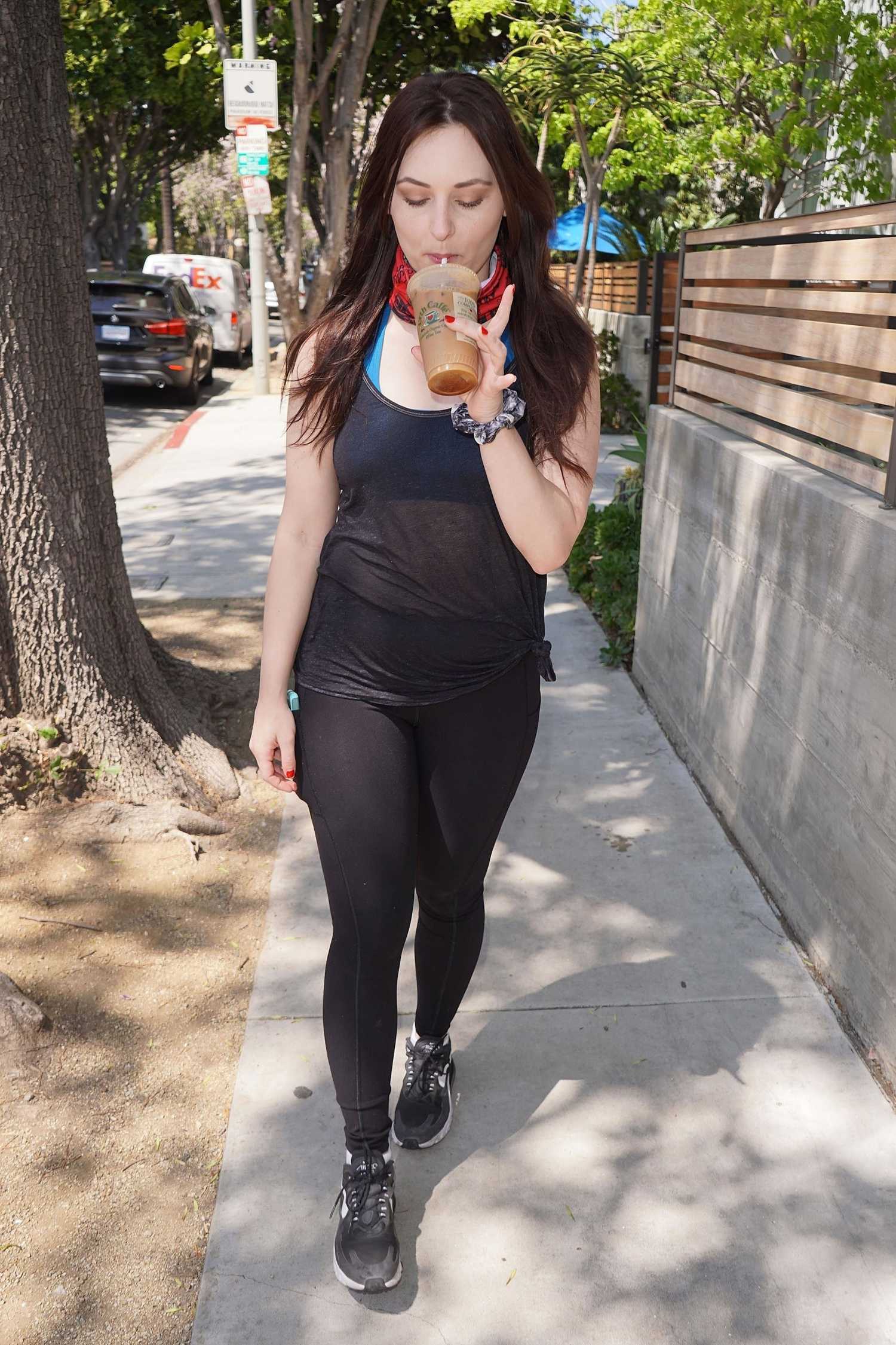 Ariel Teal Toombs in a Black Leggings Gets an Iced Coffee from Urth