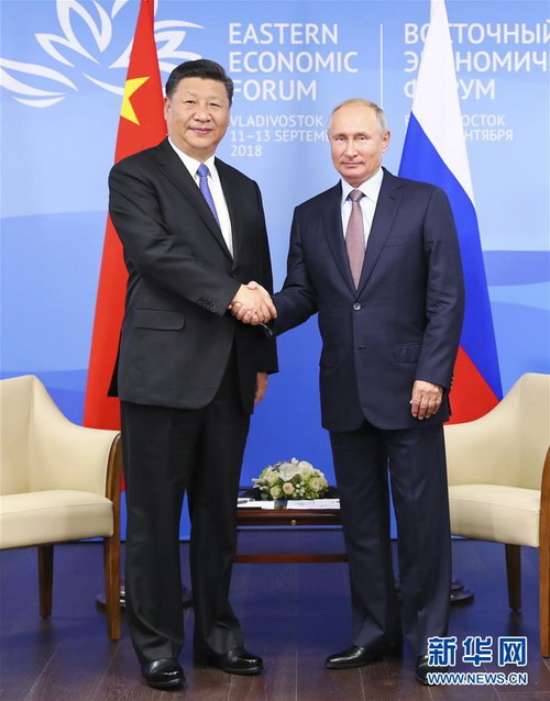 Xi, Putin vow to promote ties regardless of global changes