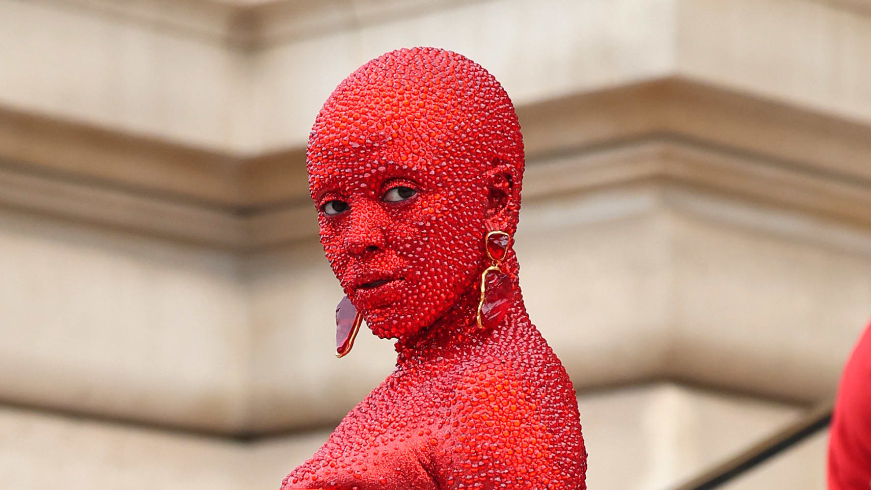 Doja Cat covers herself in red paint and 30,000 crystals for a fashion