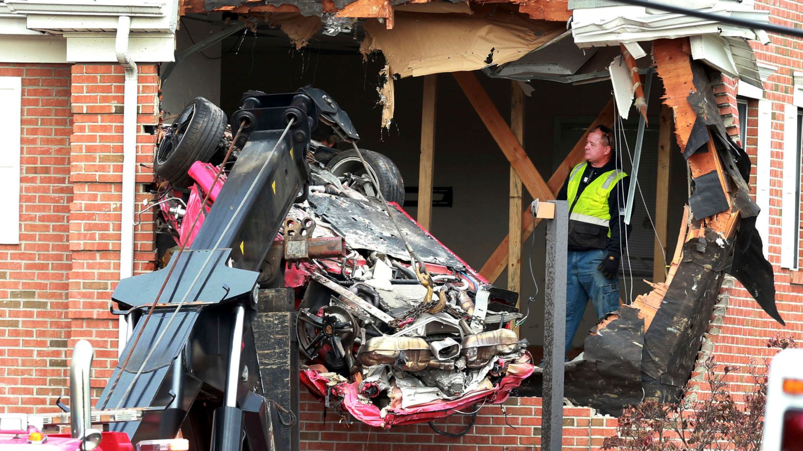 Airborne Porsche smashes into second storey of building US News Sky