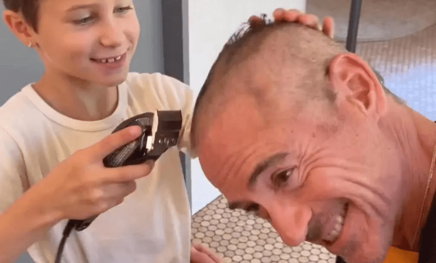 Robert Downey Jr lets his kids shave his head for a new project