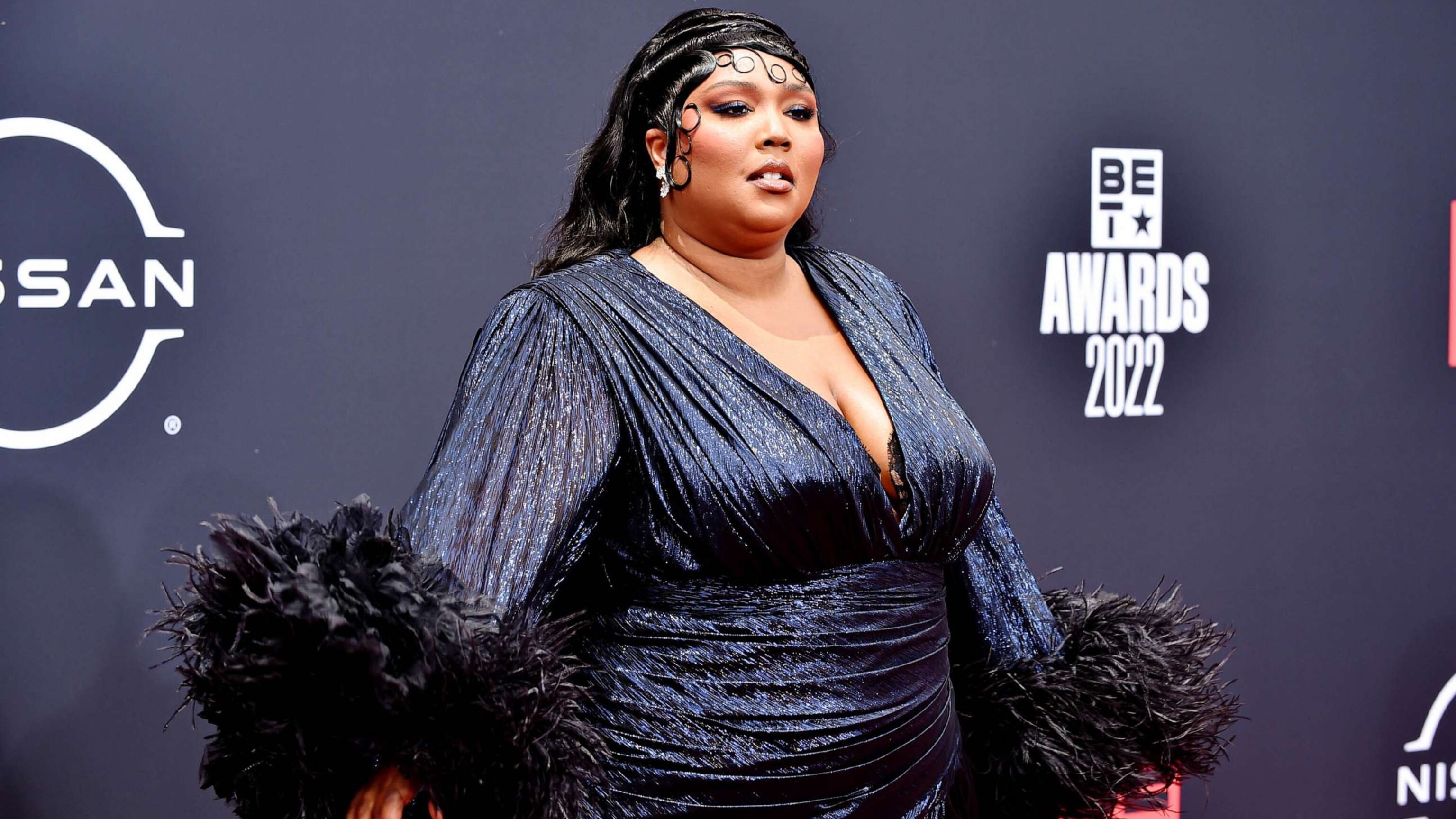 Lizzo and others sued by another employee alleging harassment, illegal