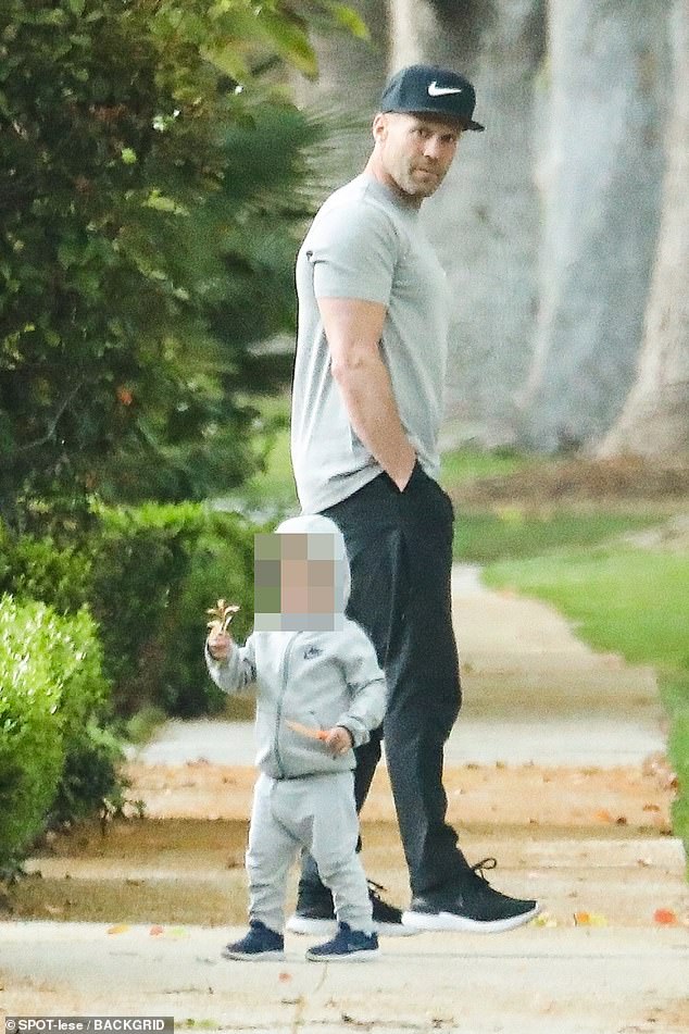 Jason Statham dons a casual ensemble as he enjoys a relaxing stroll