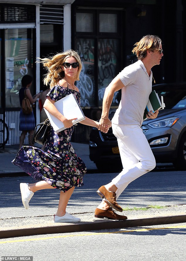 Annabelle Wallis jogs across the street with dapper boyfriend Chris