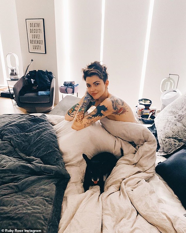 Ruby Rose shows off her tattoos as she poses in the nude