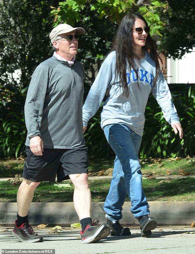 Madeleine Stowe and husband Brian Benben get some fresh air during