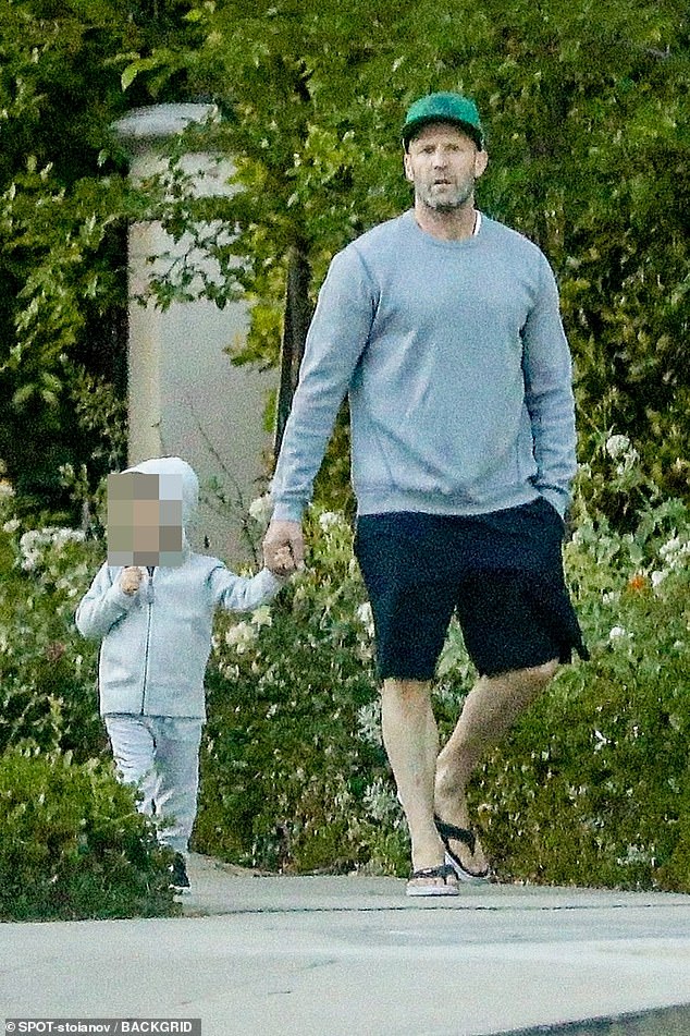 Jason Statham holds hands with son Jack, 2, during casual stroll in LA