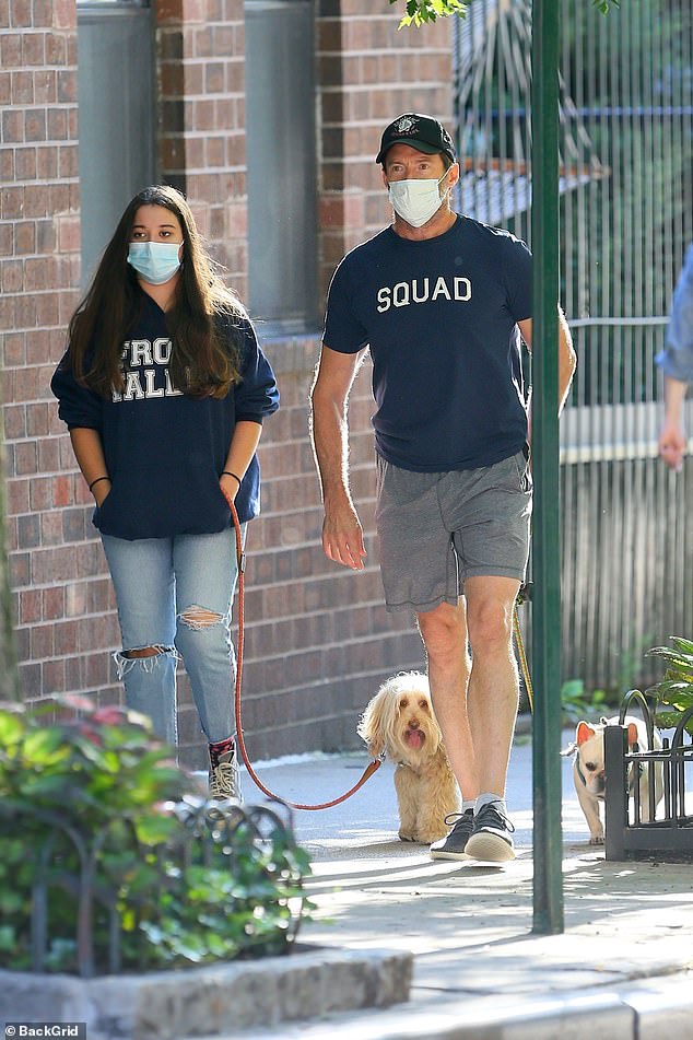 Hugh Jackman and his daughter Ava walk their dogs in New York