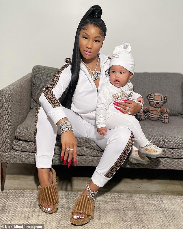 Nicki Minaj cradles ninemonthold son 'Papa Bear' as the duo sport